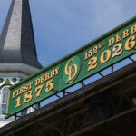 Churchill Downs employees Corey McGreal and Todd Herl work to update the iconic green Kentucky Derby sign above the Grandstand to reflect the 152nd Running of the Kentucky Derby. April 1, 2026.
